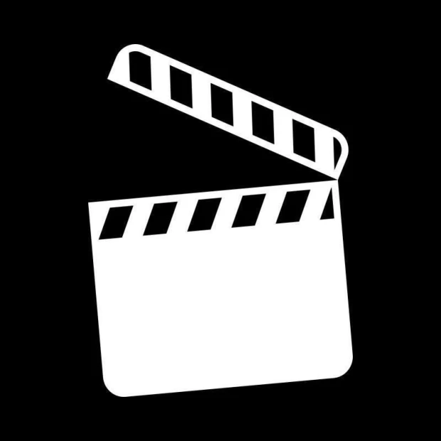 Tablica suchościeralna w kształcie klapsa filmowego na czarnym tle