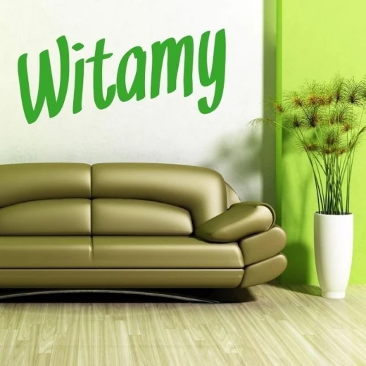 Szablon malarski z napisem Witamy w przykładowej zielonej kolorystyce na ścianie we wnętrzu