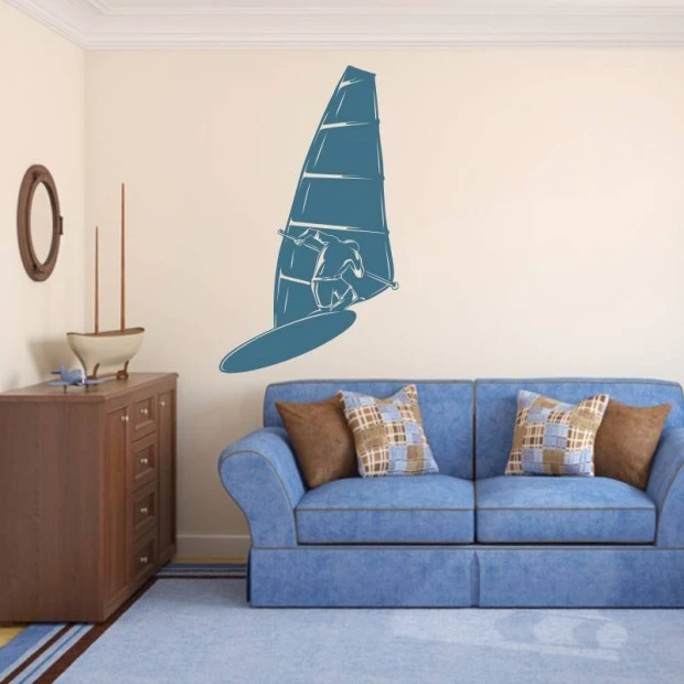 Naklejka windsurfing 2041 - Aranżacja w salonie. Ściany w jasnym kolorze, niebieska sofa z poduszkami w kratkę