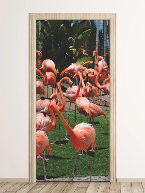 Fototapeta na drzwi flamingi FP 2535 D - Wzór graficzny. Grafika przedstawia grupę flamingów na zielonej trawie