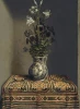 Reprodukcja Flowers in a Jug, Hans Memling - Aranżacja w wnętrzu z drewnianym stołem. Stół pokryty kolorowym obrusem
