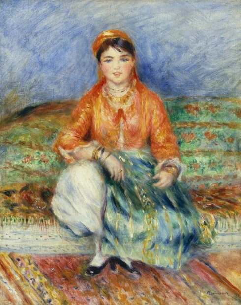 Reprodukcja Algerian Girl, Renoir Auguste - Wzór graficzny. Kobieta w kolorowym stroju siedzi na tle wzorzystego dywanu