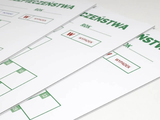 Magnetyczna suchościeralna tablica lean krzyż bezpieczeństwa 079 - Wzór graficzny. Tablica z białym tłem, zielonymi napisami