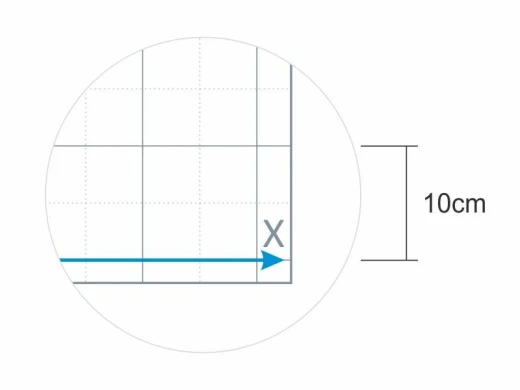 Nakładka magnetyczna z nadrukiem układu współrzędnych na zbliżeniu pokazującym wymiar kratki wynoszący 10 cm