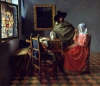 Reprodukcja The Glass of Wine, Johannes Vermeer - Aranżacja w kuchni. Ściany w odcieniach niebieskiego, drewniane meble
