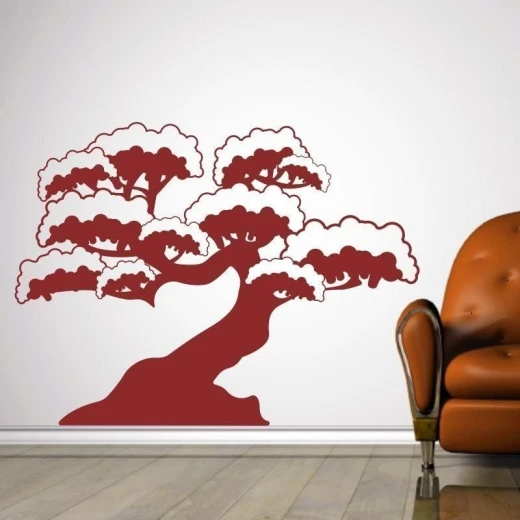 Naklejka z motywem drzewka bonsai w przykładowym bordowym kolorze, przyklejona na ścianę