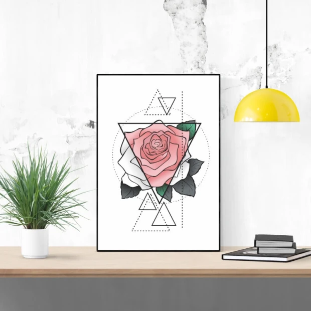 Plakat w czarnej ramie z nadrukiem różowej i białej róży wkomponowanej w geometryczne trójkąty