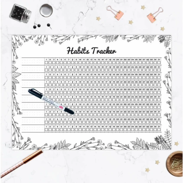 Tablica magnetyczna z przykładowym nadrukiem Habits tracker i markerem we wnętrzu