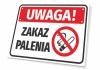 Tabliczka Uwaga zakaz palenia - Wzór graficzny. Na białym tle czerwony napis Uwaga oraz symbol przekreślonego papierosa