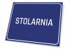 Tabliczka Stolarnia - Wzór graficzny. Prosta, prostokątna tabliczka z niebieskim tłem i białym napisem STOLARNIA