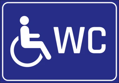 Naklejka WC dla osób niepełnosprawnych - Wzór graficzny. Postać na wózku inwalidzkim obok napisu WC