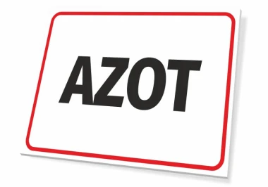 Tabliczka Azot - Wzór graficzny. Prosta tabliczka z napisem AZOT w dużych, czarnych literach na białym tle, otoczona