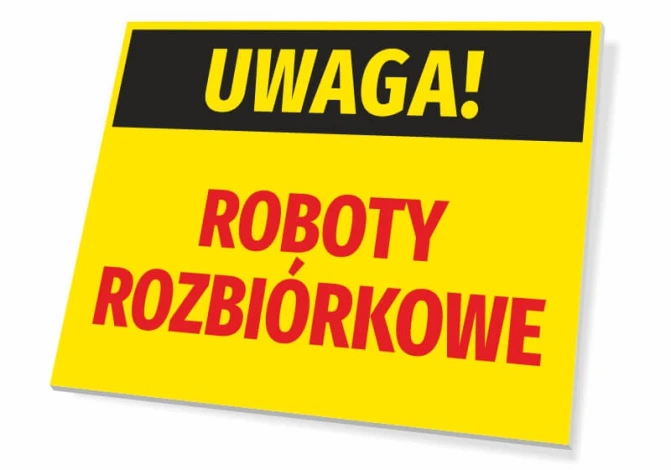 Tabliczka Uwaga Roboty rozbiórkowe - Wzór graficzny. Prostokątna tabliczka z żółtym tłem, czarnym napisem i dużymi