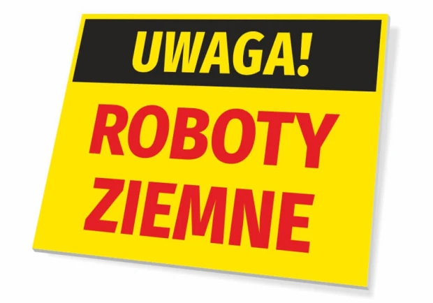 Żółta ostrzegawcza tabliczka BHP z napisem UWAGA! ROBOTY ZIEMNE na białym tle pokazującym jej grubość