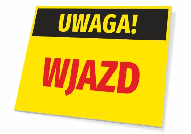 Żółta ostrzegawcza tabliczka z czarnym pasem i napisami UWAGA! WJAZD na białym tle pokazującym produkt