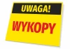Tabliczka Uwaga Wykopy - Wzór graficzny. Prostokątna tabliczka z żółtym tłem, czarnym napisem Uwaga! i czerwonym napisem