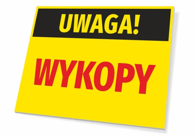 Tabliczka Uwaga Wykopy - Wzór graficzny. Prostokątna tabliczka z żółtym tłem, czarnym napisem Uwaga! i czerwonym napisem