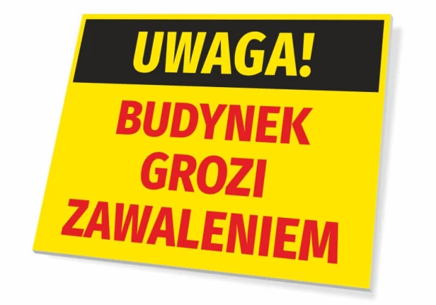 Żółta ostrzegawcza tabliczka BHP z napisem UWAGA! BUDYNEK GROZI ZAWALENIEM na białym tle