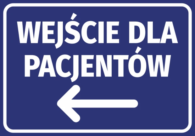 Niebieska naklejka informacyjna z białym napisem Wejście dla pacjentów i strzałką w lewo na drzwi lub ścianę