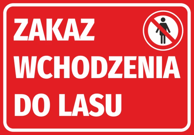 Czerwona naklejka BHP z białym napisem Zakaz wchodzenia do lasu i piktogramem zakazu ruchu pieszych