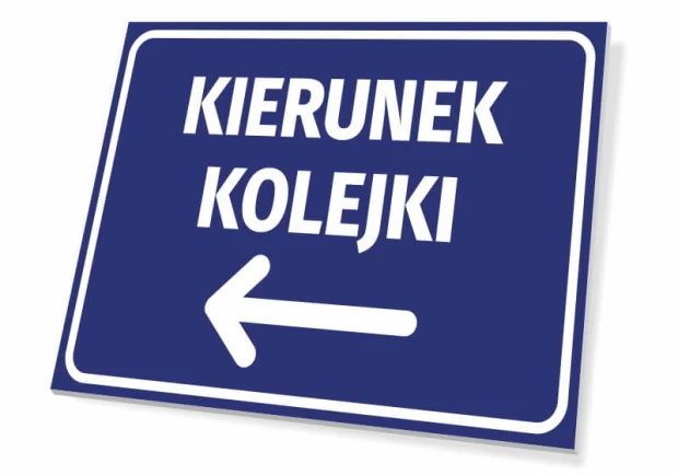 Niebieska tabliczka informacyjna z białym napisem KIERUNEK KOLEJKI i strzałką w lewo na białym tle