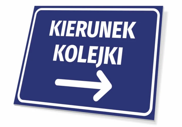 Niebieska informacyjna tabliczka z białym napisem Kierunek kolejki oraz strzałką w prawo na białym tle
