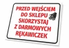 Tabliczka Przed wejściem do sklepu skorzystaj z darmowych rękawiczek - Wzór graficzny. Czerwony tekst na białym tle, obok