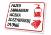 Tabliczka Przed zabraniem wózka zdezynfekuj dłonie - Wzór graficzny. Czerwony napis na białym tle, obok ikonka butelki