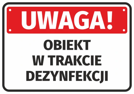 Naklejka ostrzegawcza na białym tle z czerwonym pasem i napisem Uwaga Obiekt w trakcie dezynfekcji