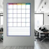 Tablica suchościeralna plan tygodnia z notatnikiem 274 - Aranżacja w biurze. Ściany są jasne, a meble w odcieniach szarości