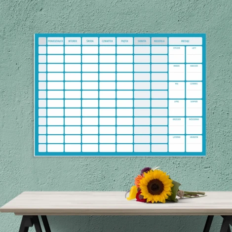 Terminarz tygodniowy suchościeralny z planerem rocznym 267 - Aranżacja w biurze. Ściana w kolorze zielonym, na niej planer