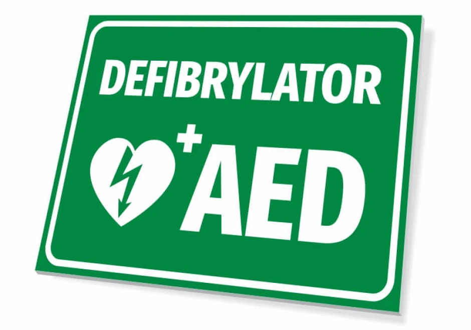 Tabliczka Defibrylator AED T562 - Wzór graficzny. Zielone tło z białym napisem i symbolem serca z błyskawicą