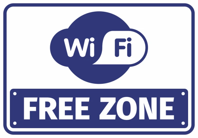 Niebiesko-biała naklejka informacyjna z piktogramem chmury, symbolem Wi-Fi oraz napisem FREE ZONE na białym tle