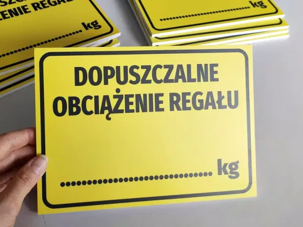 Tabliczka Dopuszczalne obciążenie regału - Wzór graficzny. Żółte tło z czarnym napisem i miejscem na wartość