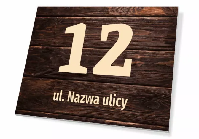 Tabliczka na dom T671, z numerem i ulicą - Wzór graficzny. Prostokątna tabliczka z dużym numerem 12 i napisem ul. Nazwa