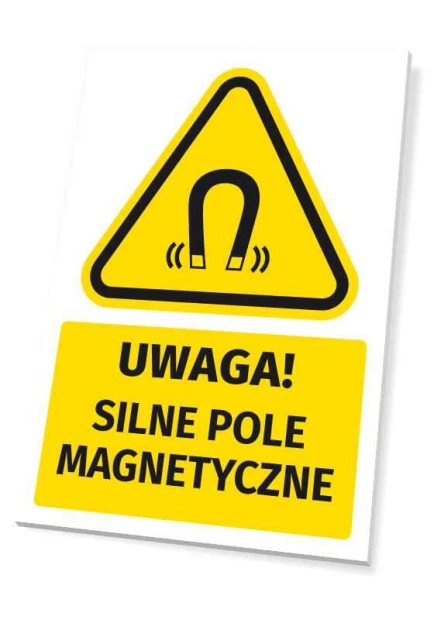 Żółta tabliczka ostrzegawcza BHP z czarnym piktogramem magnesu i napisem Uwaga! Silne pole magnetyczne