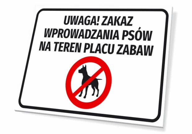 Tabliczka Uwaga! Zakaz wprowadzania psów na teren placu zabaw - Wzór graficzny. Prostokąt z białym tłem, czarny napis