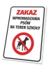 Tabliczka Zakaz wprowadzania psów na teren szkoły - Wzór graficzny. Prostokątna tabliczka z białym tłem, czerwonym napisem
