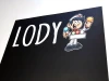 Tablica kredowa z nadrukiem Lody 098 - Wzór graficzny. Na czarnym tle widoczny napis LODY oraz postać sprzedawcy lodów