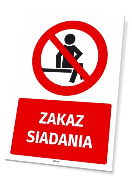 Tabliczka BHP Zakaz siadania - Wzór graficzny. Czerwony okrąg z przekreśloną postacią siedzącą, pod nim napis ZAKAZ SIADANIA