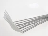 Płyta PCV 2mm biała PVC na wymiar - Wzór graficzny. Proste, prostokątne płyty ułożone w stos