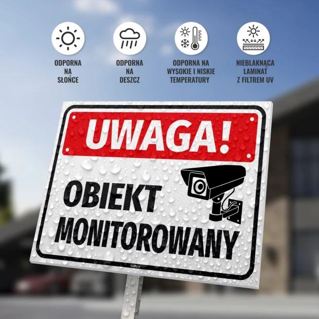 Tabliczka Uwaga obiekt monitorowany - Wzór graficzny. Prosta tabliczka z białym tłem, dużym napisem UWAGA! oraz ikoną kamery