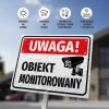 Tabliczka Uwaga obiekt monitorowany - Wzór graficzny. Prosta tabliczka z białym tłem, dużym napisem UWAGA! oraz ikoną kamery