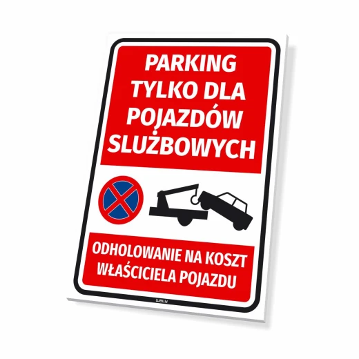 Prostokątna tabliczka z napisem Parking tylko dla pojazdów służbowych i informacją o odholowaniu na białym tle