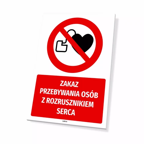 Tabliczka Zakaz przebywania osób z rozrusznikiem serca - Wzór graficzny. Czerwony okrąg z przekreślonym sercem i kluczem