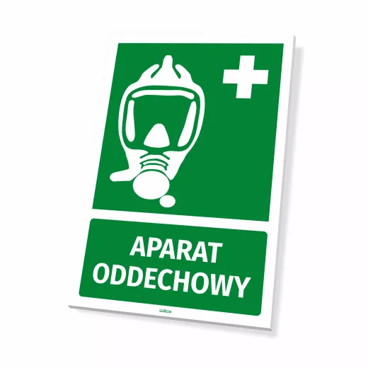 Zielona tabliczka BHP z białym piktogramem maski, krzyżem i napisem APARAT ODDECHOWY, pokazana na białym tle