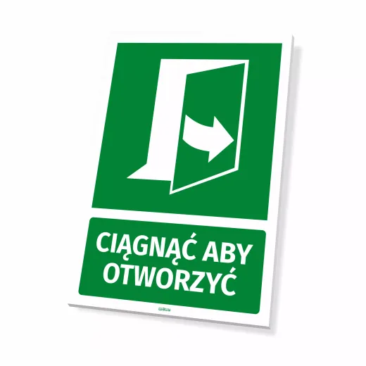 Zielona tabliczka informacyjna BHP z piktogramem drzwi i napisem Ciągnąć by otworzyć, ukazująca grubość płyty