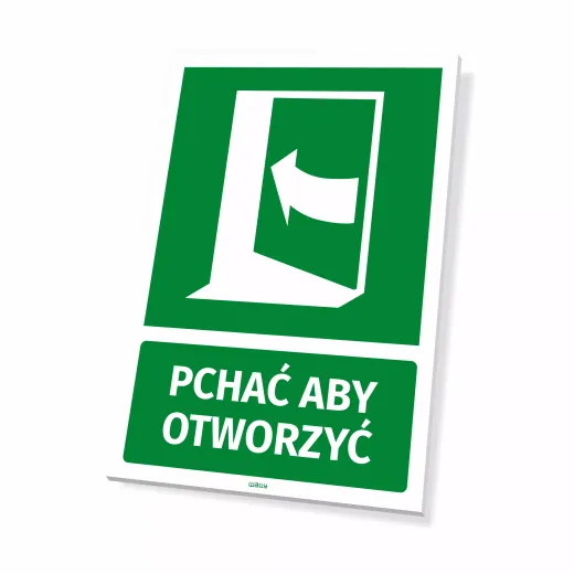 Zielona tabliczka ewakuacyjna z białym piktogramem drzwi i napisem Pchać aby otworzyć na białym tle