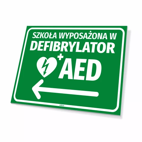 Tabliczka BHP: Szkoła wyposażona w defibrylator AED, ze strzałką w lewo - Wzór graficzny. Zielone tło, biały tekst, symbol