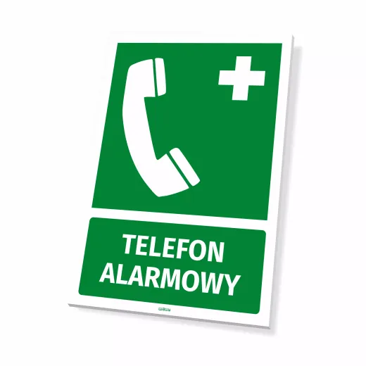 Zielona tabliczka BHP Telefon alarmowy z białym piktogramem słuchawki i krzyża, pokazująca grubość płyty